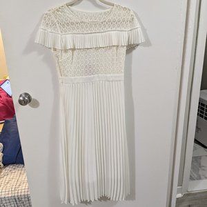 White Dress with Pleated Skirt and Lace Paneled Top